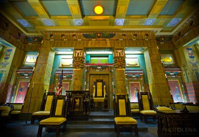 The winged sun suspended over the Worshipful Master’s throne in the Egyptian room of a Masonic Temple Grand Lodge.jpg